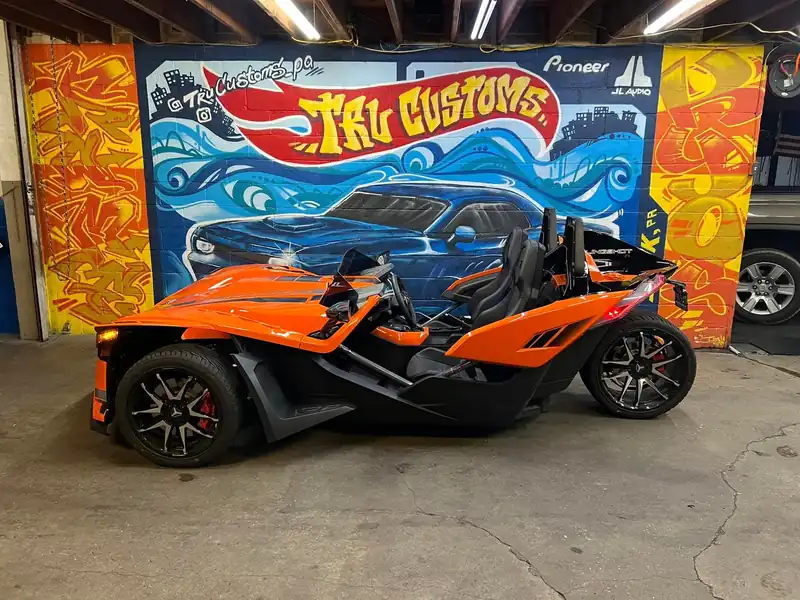 Orange and black Polaris Slingshot R three-wheeler